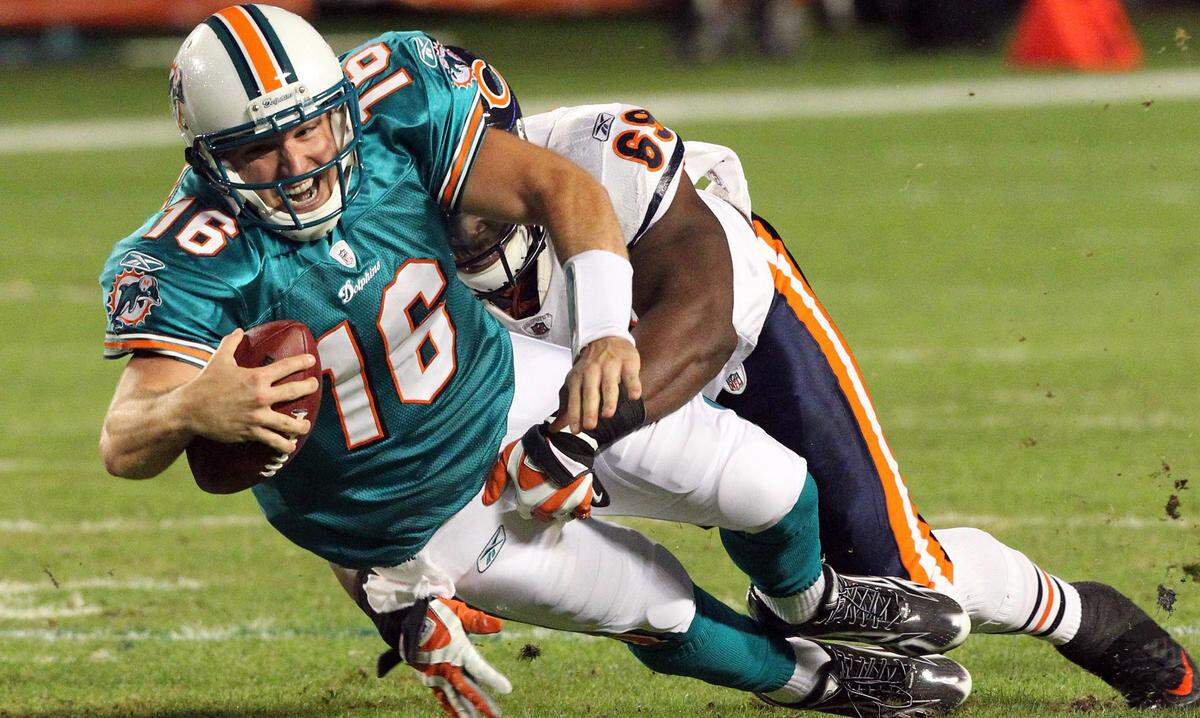 Miami Dolphins quarterback Tyler Thigpen (16) is sacked in the second quarter by the Chicago Bears’ Henry Melton in NFL action at Sun Life Stadium in Miami, Florida, on Thursday, November 18, 2010.