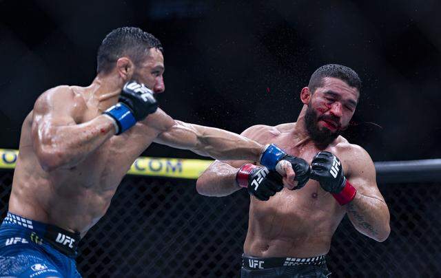 Patricio Pitbull of Brazil and Aaron Pico of the United States fight in their featherweight bout at UFC 327 at the Kaseya Center on Saturday, April 11, 2026, in downtown Miami, Fla.