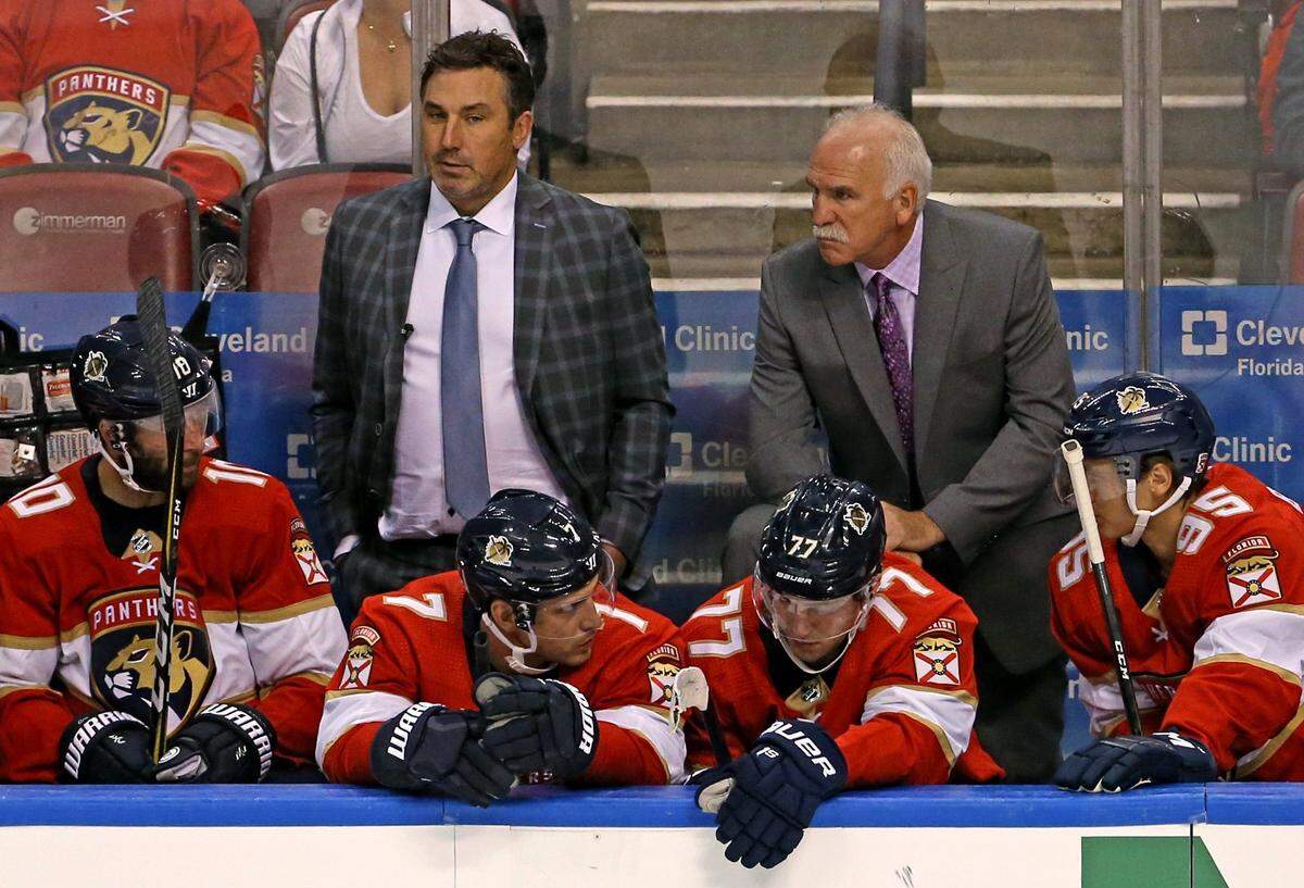 Florida Panthers head coach Joel Quenneville and assistant coach Andrew Brunette look from the bench during the third period of an NHL hockey game against the Carolina Hurricanes at the BB&T Center on Tuesday, October 8, 2019 in Sunrise.