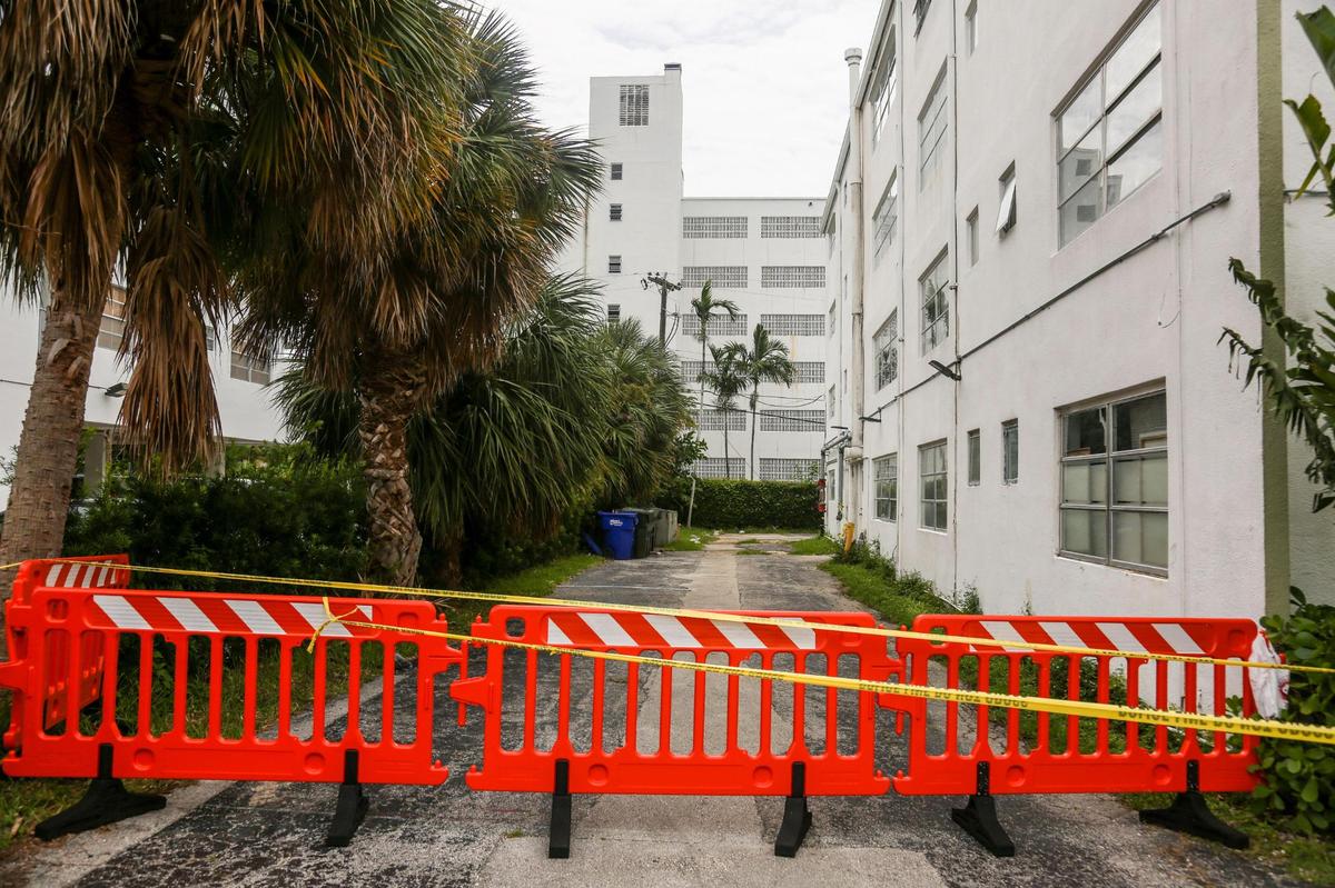 Yellow tape and police barricades block access to the Forum building at 1080 93rd Street in Bay Harbor Islands, Florida, after city officials deemed the building to be unsafe on Wednesday, Sept. 1, 2021.
