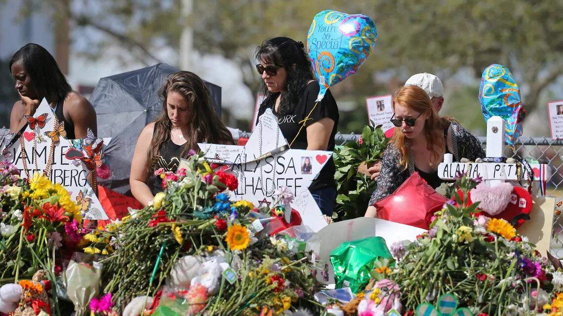 In 2018, mourners bring flowers, balloons and other items to pay tribute to the 17 people killed at Marjory Stoneman Douglas High School in 2018. The mass shooter’s sentencing trial finally begins Monday .