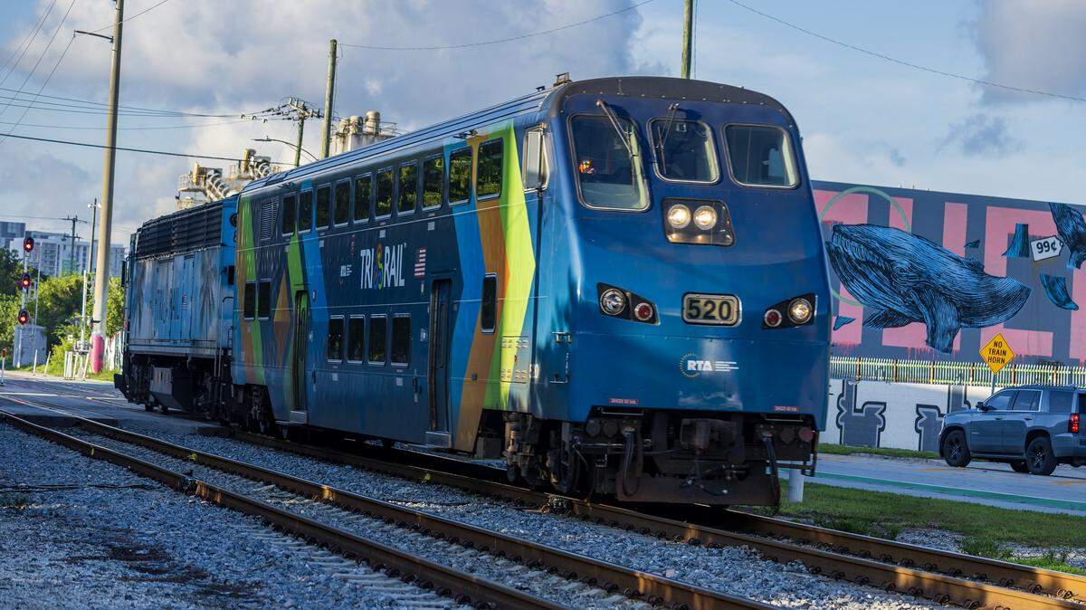 A TriRail train heads North at the 20th Street and Miami Avenue intersection as Miami Police officers and FDOT joined together during Operation Clear Track, to monitor railroad grade crossings for an opportunity to share the rail safety method with the community, wit the goal to reduce pedestrian and driver injuries and fatalities around railroad tracks increasing public awareness on the issue, in Miami, on Tuesday September 16, 2025.
