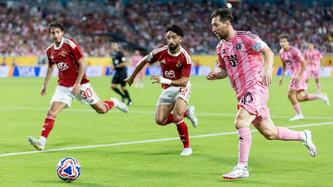 Inter Miami forward Lionel Messi (10) runs with the ball as Al Ahly FC midfielder Marawan Attia (13) defends in the second half of their Group A first-round FIFA Club World Cup soccer match at Hard Rock Stadium on Saturday, June 14, 2025, in Miami Gardens, Fla.