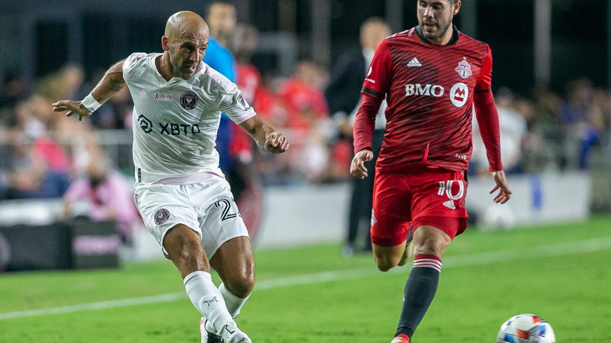 Inter Miami forward Federico Higuain (22) passes the ball past Toronto FC midfielder Alejandro Pozuelo (10) during the first half of their MLS soccer match at DRV PNK Stadium on October 20, 2021. Pozuelo is expected to be traded to Inter Miami for the second half of the 2022 season.
