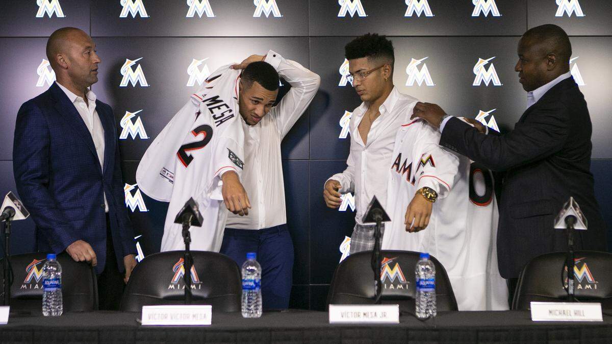 From left to right: Derek Jeter, Victor Victor Mesa and his brother, Victor Mesa Jr., during a press conference announcing the Mesas’ signing to the Miami Marlins at Marlins Park in Little Havana on Monday, October 22, 2018.
