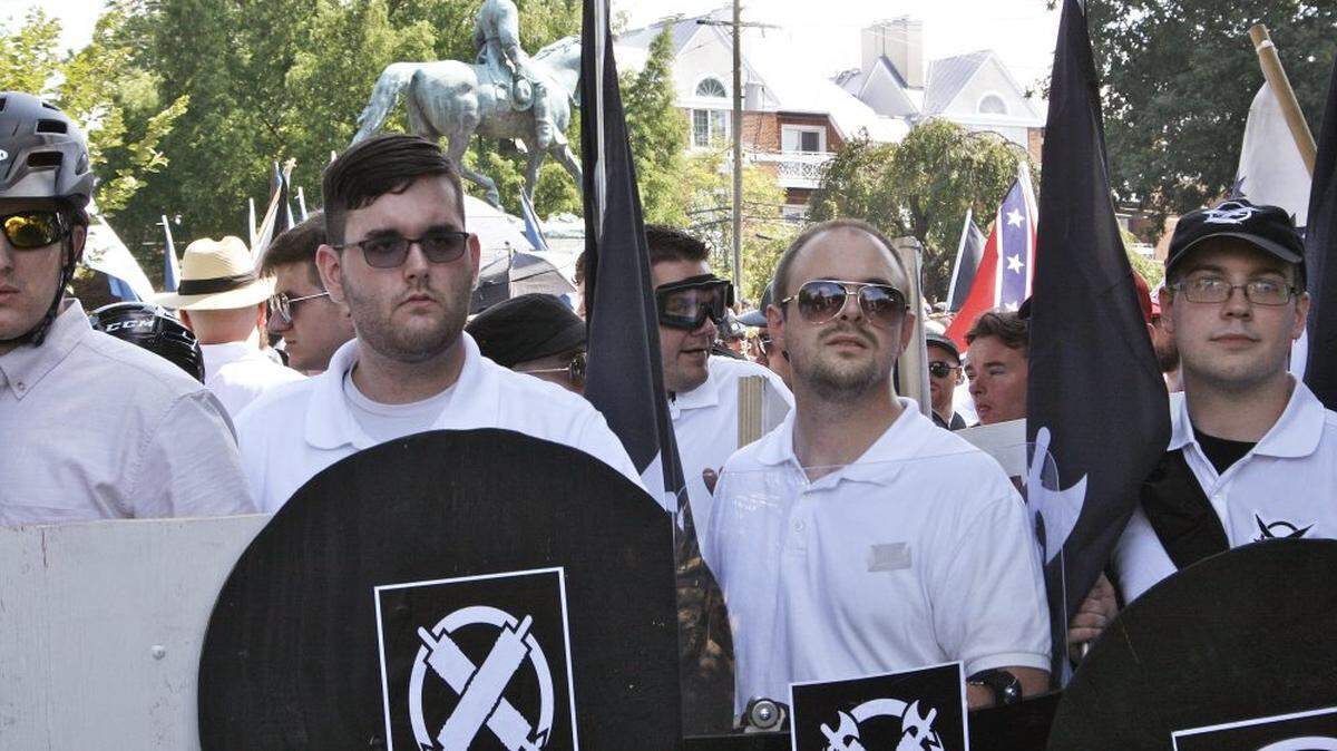 James Alex Fields Jr., second from left, in Charlottesville, Va., where a white supremacist rally took place in 2017. Fields, the driver in a deadly car attack at the rally, was sentenced to life in prison.