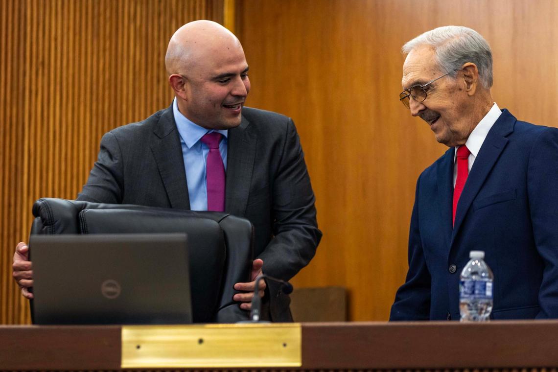 Hialeah Council member Jesus Tundidor leads interim council member Juan Francisco Junco to his seat during a meeting at Hialeah City Hall on Tuesday, Nov. 12, 2024, in Hialeah, Fla.
