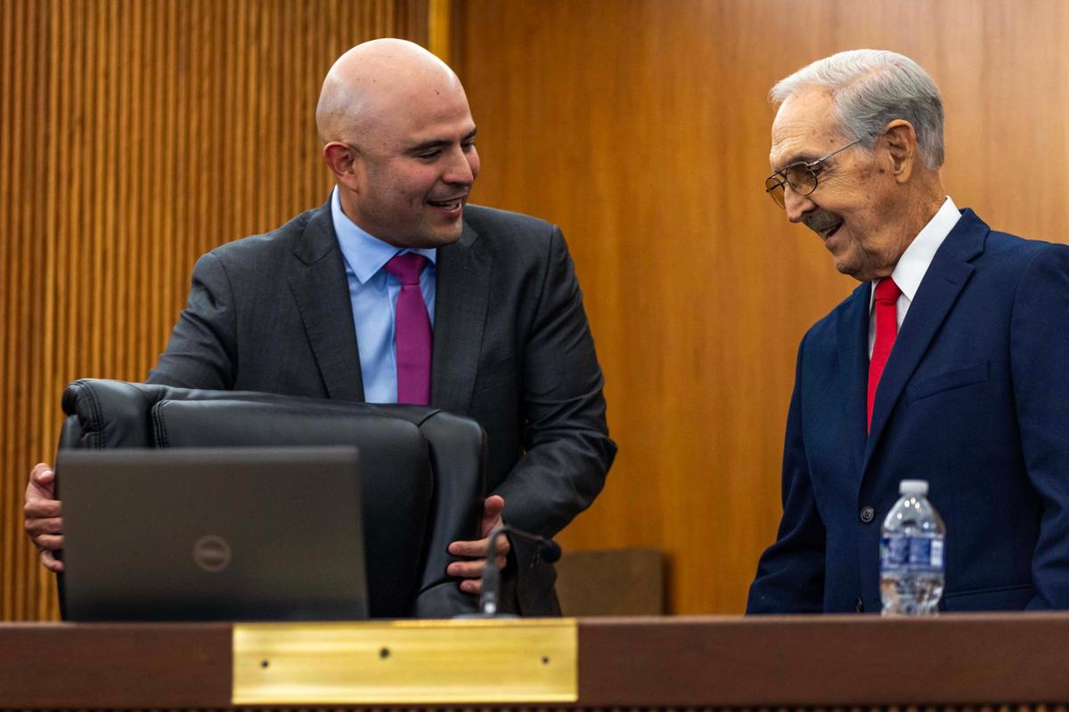 Hialeah City Council President Jesus Tundidor leads new interim council member Juan Francisco Junco to his seat during a meeting at Hialeah City Hall on Tuesday, Nov. 12, 2024.