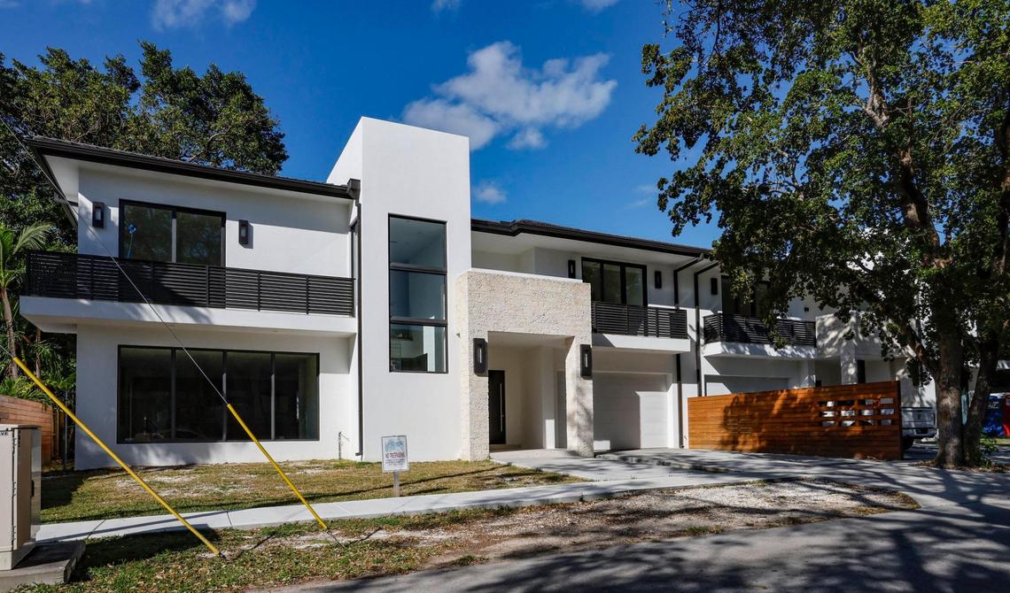 Newly constructed homes along the 3100 block of Shipping Avenue in Coconut Grove on Wednesday, Feb. 15, 2023. Cox tells buyers he’s finishing his own dream townhouse at 3167 Shipping Ave. in central Coconut Grove. The adjacent one is under contract with a buyer from New York City who is getting impatient.