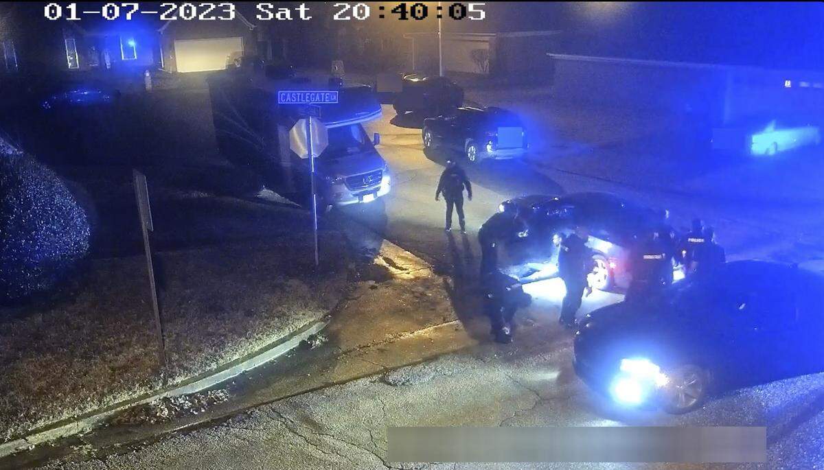 In this image from video released and partially redacted by the city of Memphis, Tenn., on Jan. 27, 2023, Tyre Nichols leans against a car after a brutal attack by five Memphis Police officers on Jan. 7, in Memphis.