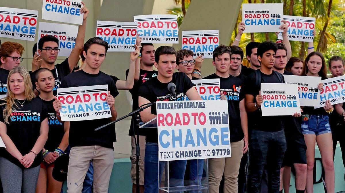 Former Marjory Stoneman Douglas High School student Cameron Kasky, center, talks at a press conference for the "March for Our Lives" movement at Pines Trails Park in Parkland, Florida, on June 4, 2018.