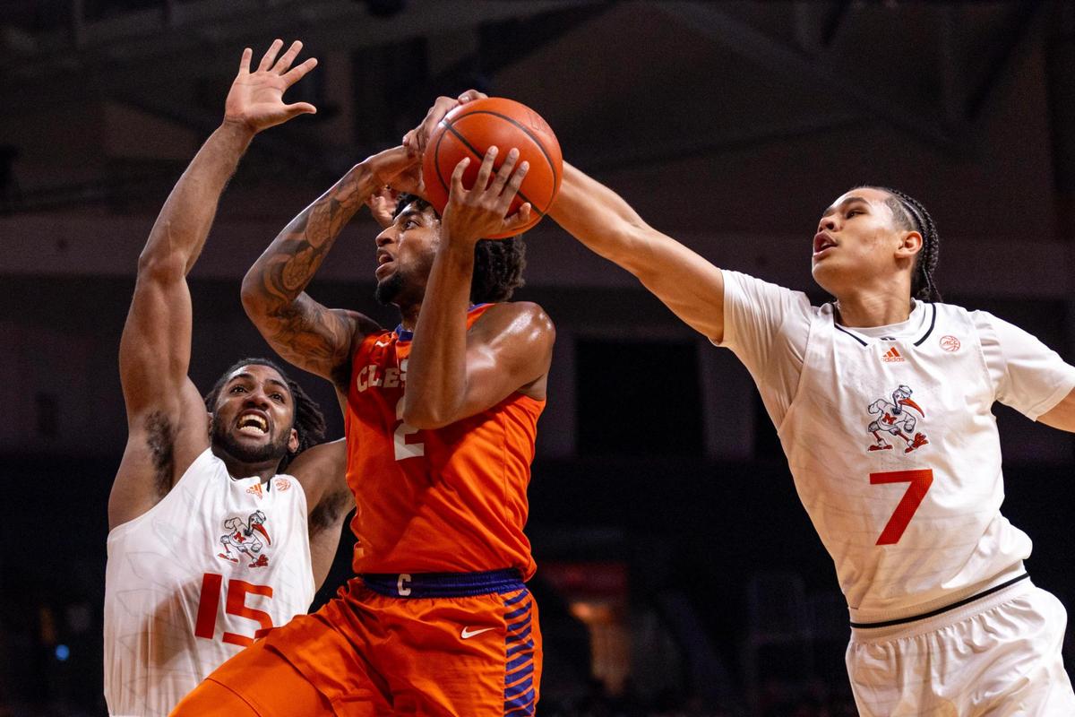 Miami Hurricanes forward Norchad Omier fights for the rebound with University of Clemson center PJ Hall (24) during the first half of an NCAA basketball game at the Watsco Center in Coral Gables, Florida, on Wednesday, January 3, 2024.