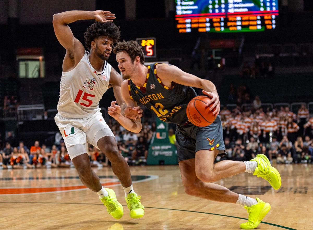 Hurricanes forward Norchad Omier (15) defends the drive by Boston College Eagles forward Quinten Post (12) during the first half of an NCAA basketball game at Watsco Center in Coral Gables, Florida on Wednesday, March 6, 2024.