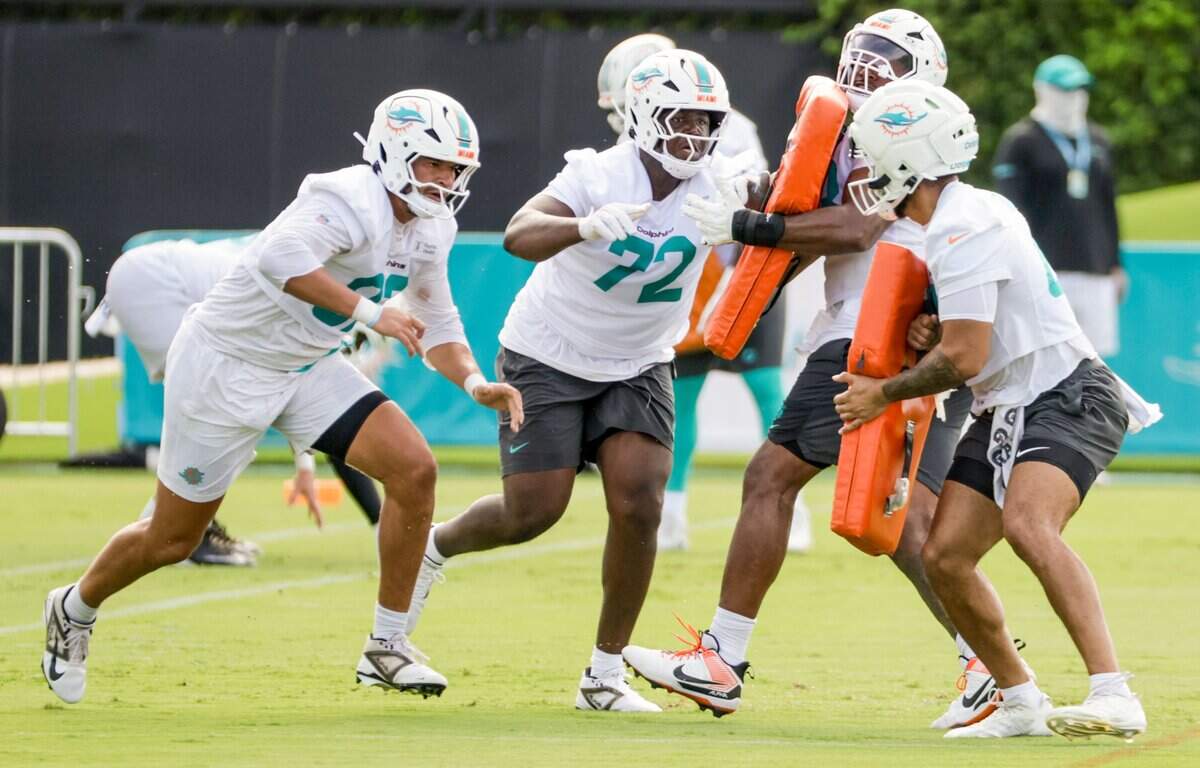 Miami Dolphins offensive tackle Gottlieb Ayedze (72) battles teammates during practice drills at the Miami Dolphins Training Camp in Miami Gardens, Florida, on Thursday, July 30, 2026.