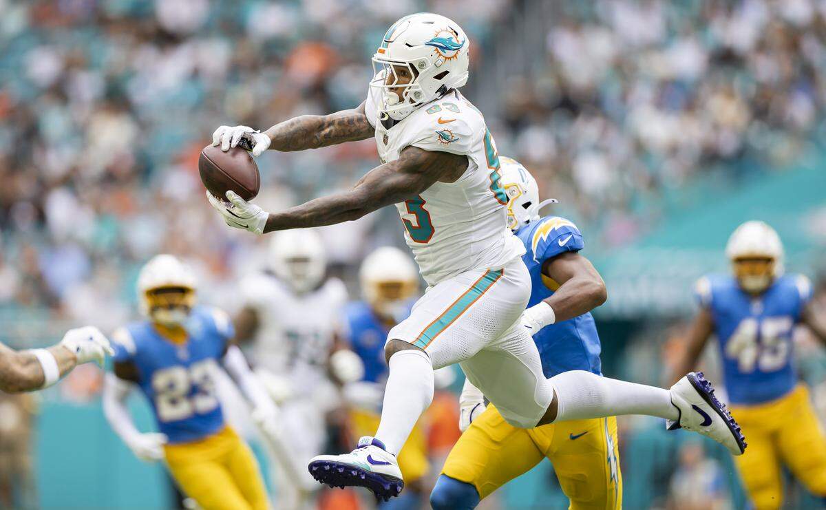 Miami Dolphins tight end Darren Waller (83) catches a pass against the Los Angeles Chargers in the first half of their NFL game at Hard Rock Stadium on Sunday, Oct. 12, 2025, in Miami Gardens, Fla.