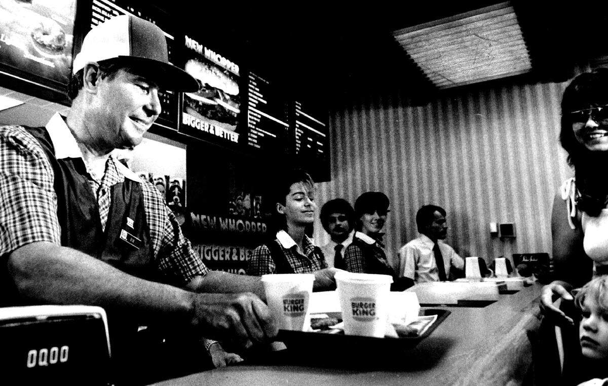 Former governor and senator Bob Graham serves up breakfast at Burger King at 17th Street and Federal Highway in Fort Lauderdale in 1985 on one of his campaign “work days.”