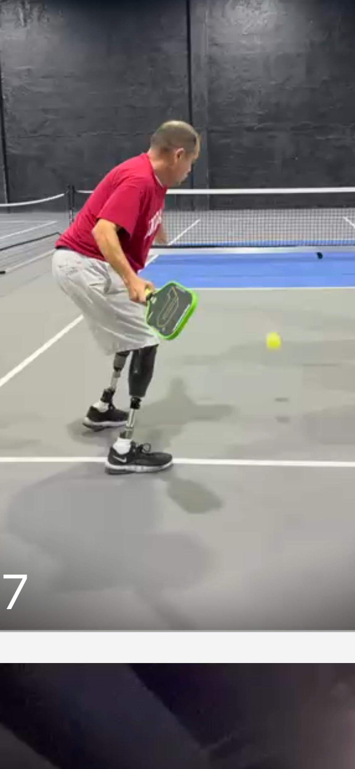 Hector Perez, 61, plays pickleball under the guidance of coach Carlos Marquez at Doral’s Champions club.