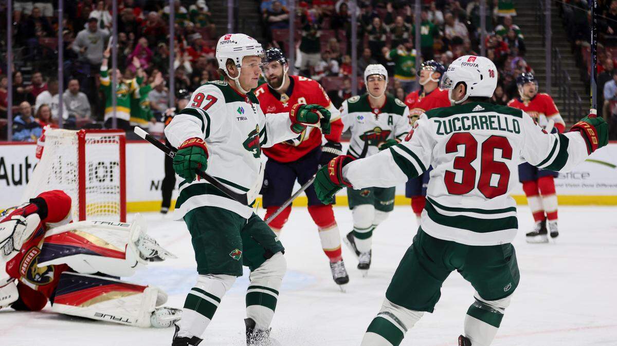 Jan 19, 2024; Sunrise, Florida, USA; Minnesota Wild left wing Kirill Kaprizov (97) celebrates with right wing Mats Zuccarello (36) after scoring against the Florida Panthers during the first period at Amerant Bank Arena. Mandatory Credit: Sam Navarro-USA TODAY Sports
