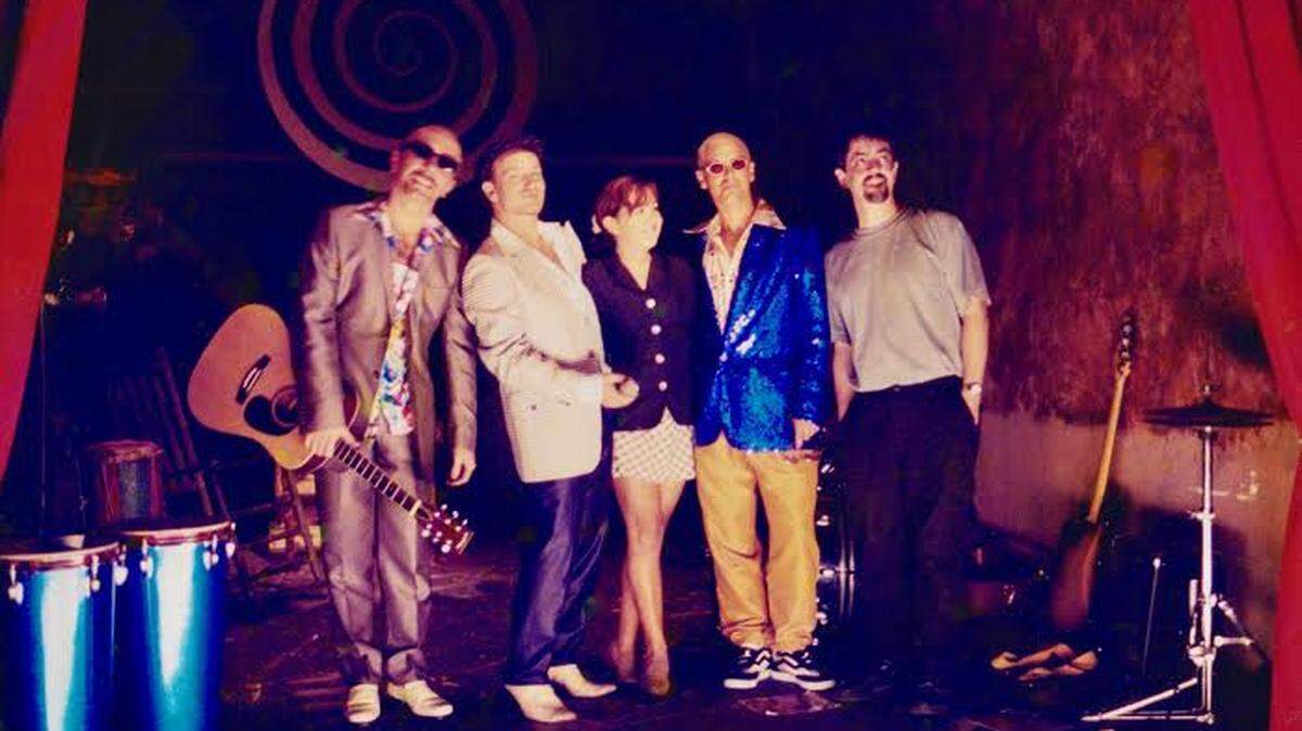 From left: Adam Clayton; Bono; Maria Banda-Rodaz; The Edge; John Rodaz. They are members of the band U2; Maria and John are founders of Area Stage Company in Coral Gables.