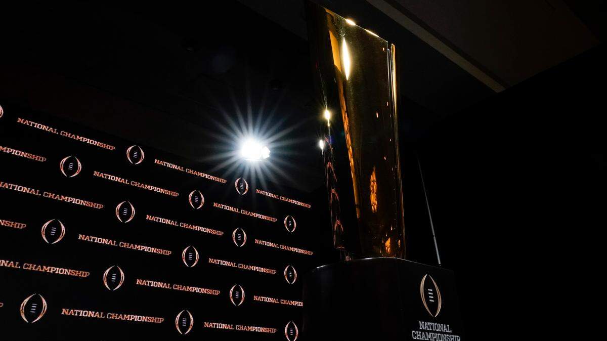 The trophy is displayed before a news conference for the NCAA College Football Playoff national championship game Sunday, Jan. 12, 2020, in New Orleans. Clemson is scheduled to play LSU on Monday.