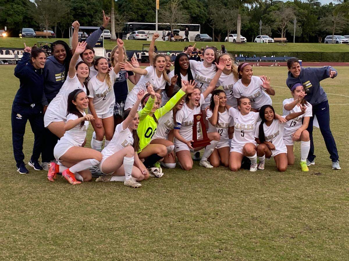 North Broward Prep’s girls’ soccer team celebrates its first-ever trip to the state semifinals following its victory in penalty kicks over Palmer Trinity on Tuesday afternoon in the Region 4-3A final.