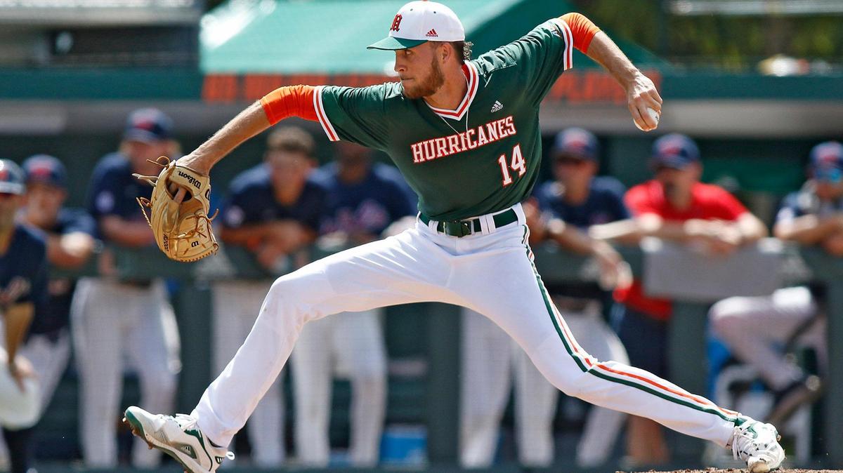 UM Hurricanes starting pitcher Carson Palmquist (14) delivers a pitch during the NCAA baseball regional game against Ole Miss Rebels on Sunday, June 5, 2022 at Alex Rodriguez Park at Mark Light Field in Coral Gables. Andrew Uloza / for THE MIAMI HERALD