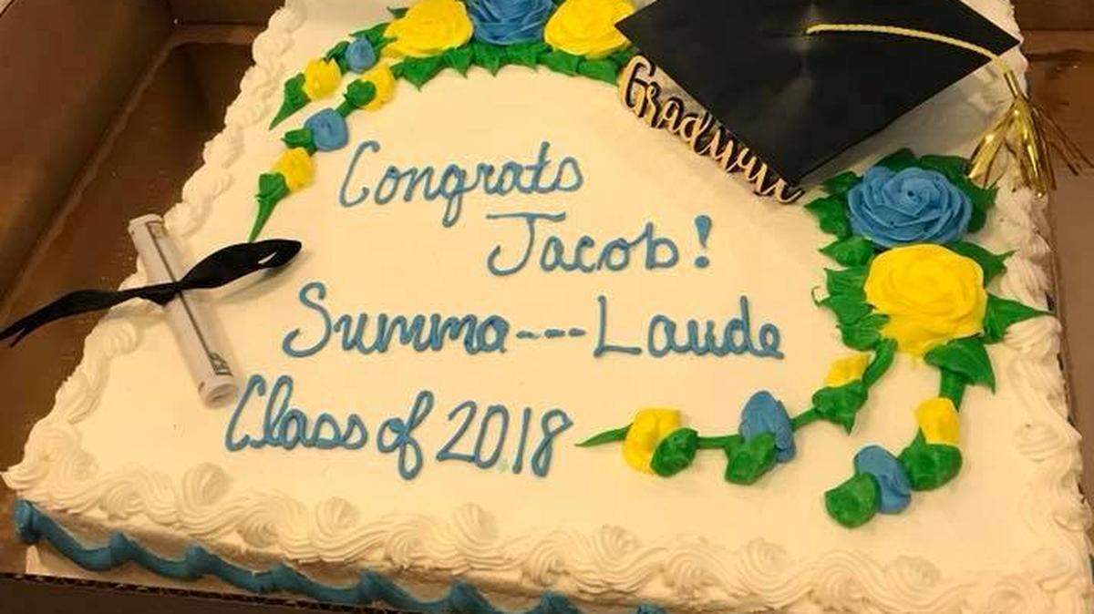 Charleston, South Carolina mom Cara Koscinski posted this photo on her Facebook page of a cake she ordered from Publix for her son's graduation party on May 19, 2018. The cake was supposed to include the Latin phrase "Summa Cum Laude" to represent "with the greatest distinction." But cake makers dashed out the Latin preposition for "with" because it appeared on a list of prohibited words.
