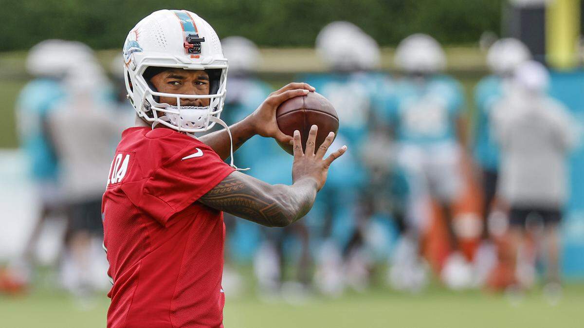 Miami Dolphins quarterback Tua Tagovailoa (1) passes the ball during practice at Baptist Health Training Complex in Miami Gardens, Florida, on Wednesday, July 24, 2024.