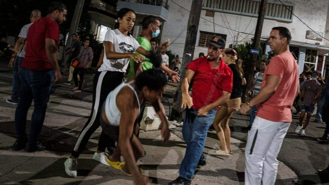A plain-clothed police officer confronts a demonstrator during a protest calling for the restoration of electrical service after six days of blackouts due to the devastation of Hurricane Ian in Havana, Cuba, Saturday, Oct 1, 2022.