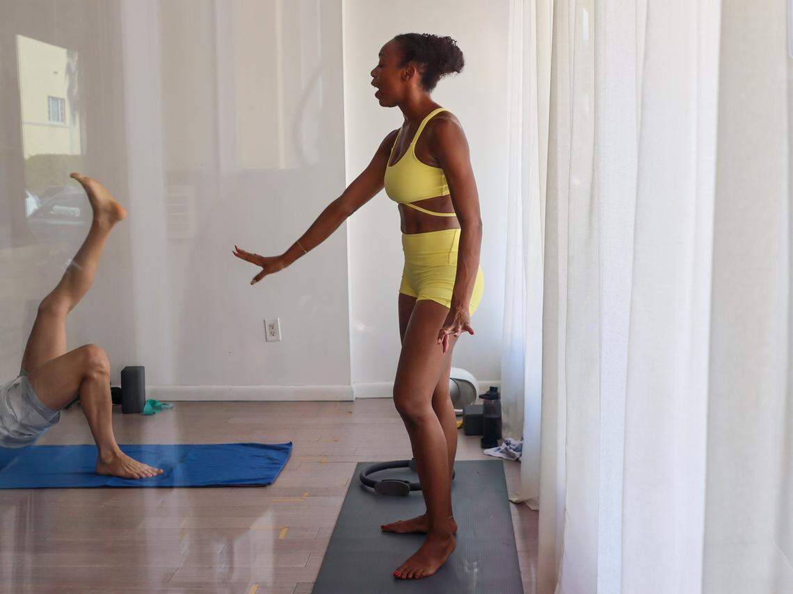 Navy vet and Pilates instructor Shay Williams conducts her Pilates class at Hanu Yoga in Miami Beach, Florida on Sunday, November 9, 2025.