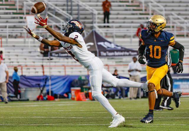 Homestead Broncos Cortez Mills (2) dives for a first down pass reception as St. Thomas Aquinas Bryant Allen (10) defends in the second half of the Class 3M state championships at Bragg Memorial Stadium in Tallahassee, Florida on Saturday, December 9, 2023.