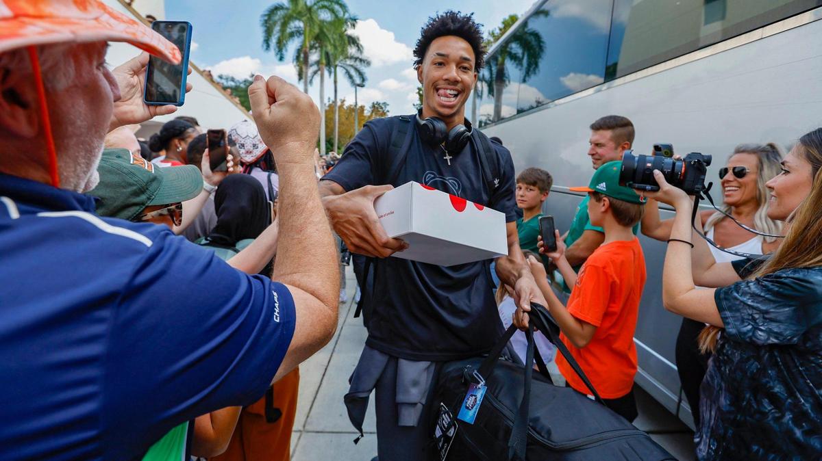 Miami Hurricanes men’s basketball player Jordan Miller is greeted by fans outside the University of Miami’s Watsco Center as the team prepares to depart on Wednesday, March 29, 2023, for the NCAA Final Four games in Houston.