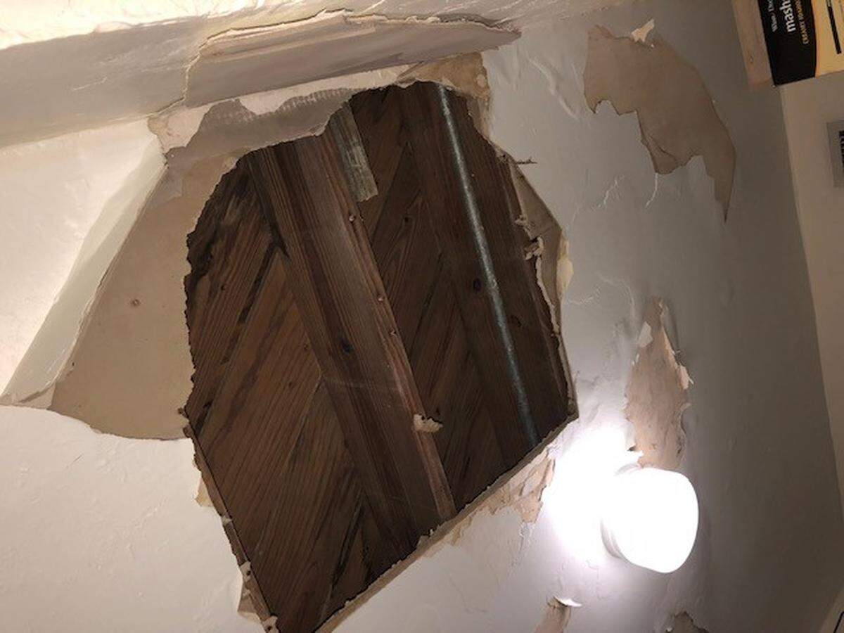 A hole in the ceiling of a Crespi Park apartment previously managed by the Miami Beach Community Development Corporation. Miami-Dade County has since taken control of the building.