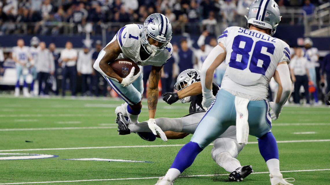 Dallas Cowboys wide receiver Cedrick Wilson (1) is stopped short of scoring on a two-point conversion attempt by Las Vegas Raiders safety Johnathan Abram, right rear, as tight end Dalton Schultz (86) looks on in the second half of an NFL football game in Arlington, Texas, Thursday, Nov. 25, 2021.