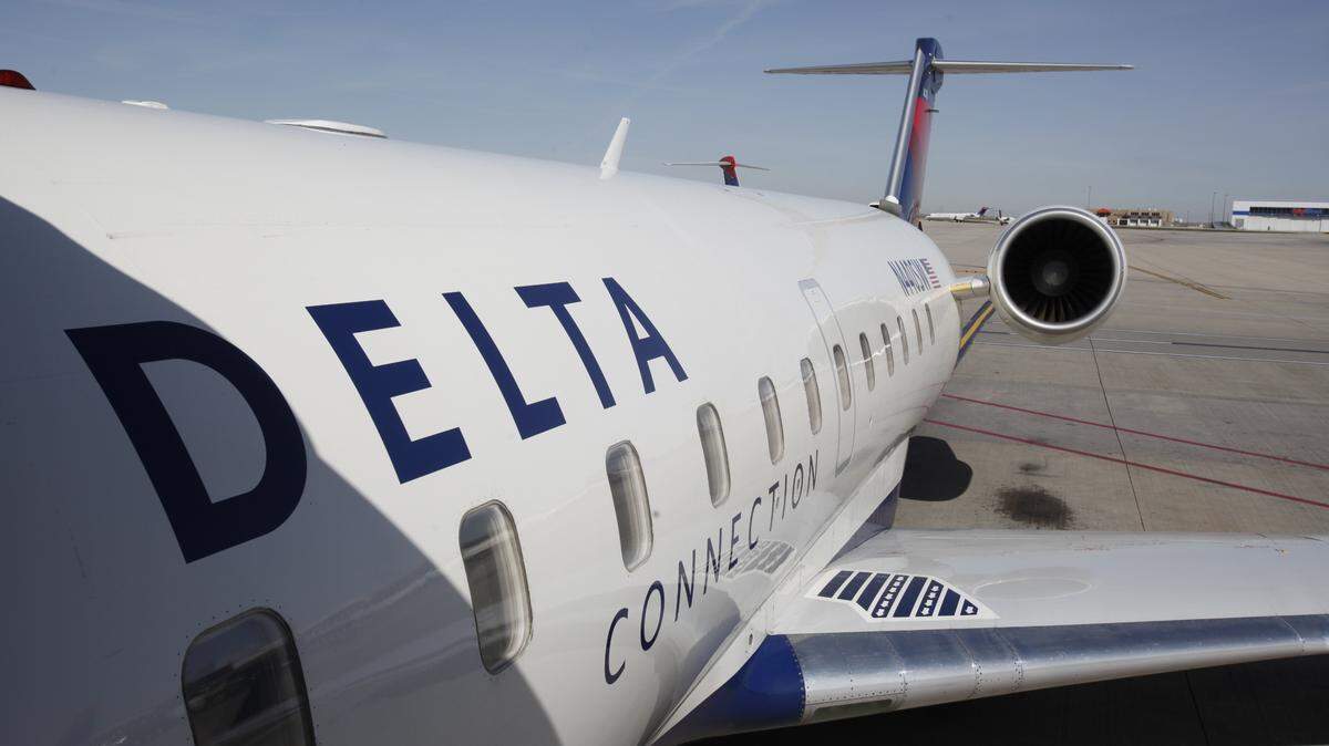 Three women are accused of attacking a Delta Air Lines officer when denied boarding at an airport in New York, federal officials said. They were arrested.