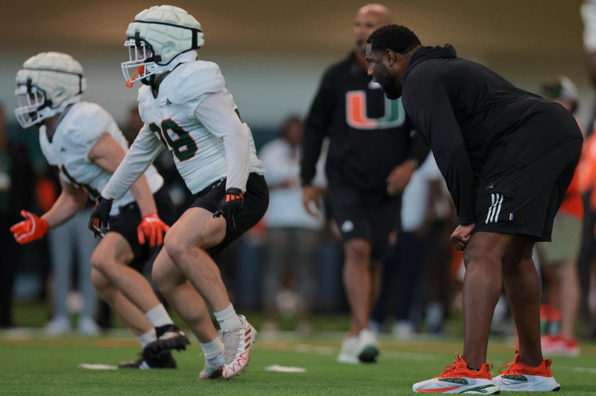 Miami Hurricanes defensive tackles coach Damione Lewis coaches during spring practice at the Carol Soffer Indoor Practice Facility at the University of Miami in Coral Gables, Florida, Thursday, March 20, 2025.