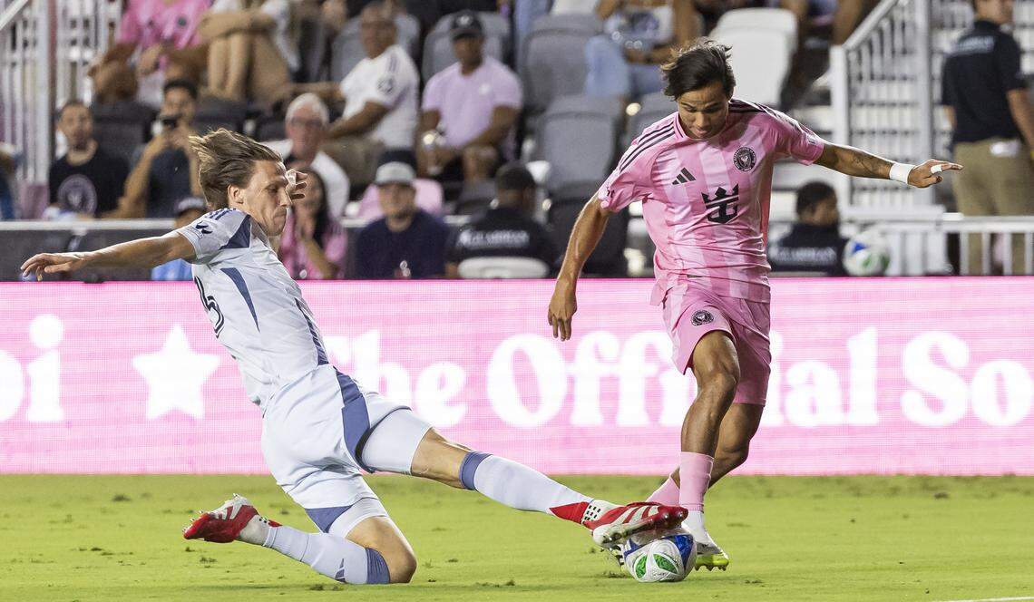 Inter Miami midfielder Telasco Segovia (8) runs with the ball as Chicago Fire defender Jack Elliott (3) defends in the first half of their MLS match at Chase Stadium on Tuesday, Sept. 30, 2025, in Fort Lauderdale, Fla.