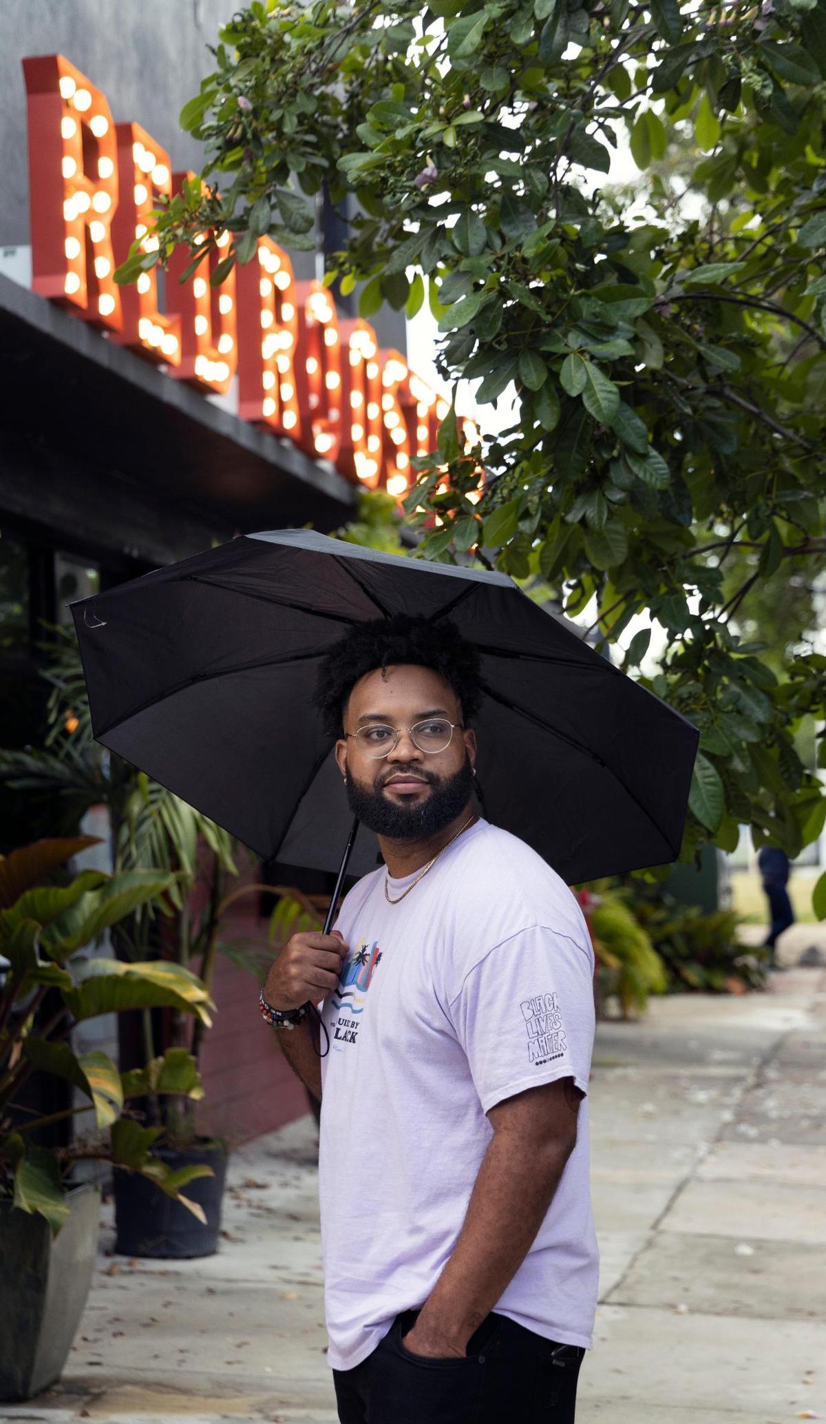 Everton Allen, owner of 3o5 Brand, is photographed wearing his apparel outside Red Rooster in Miami’s historic Overtown neighborhood on Thursday, August 12, 2021.