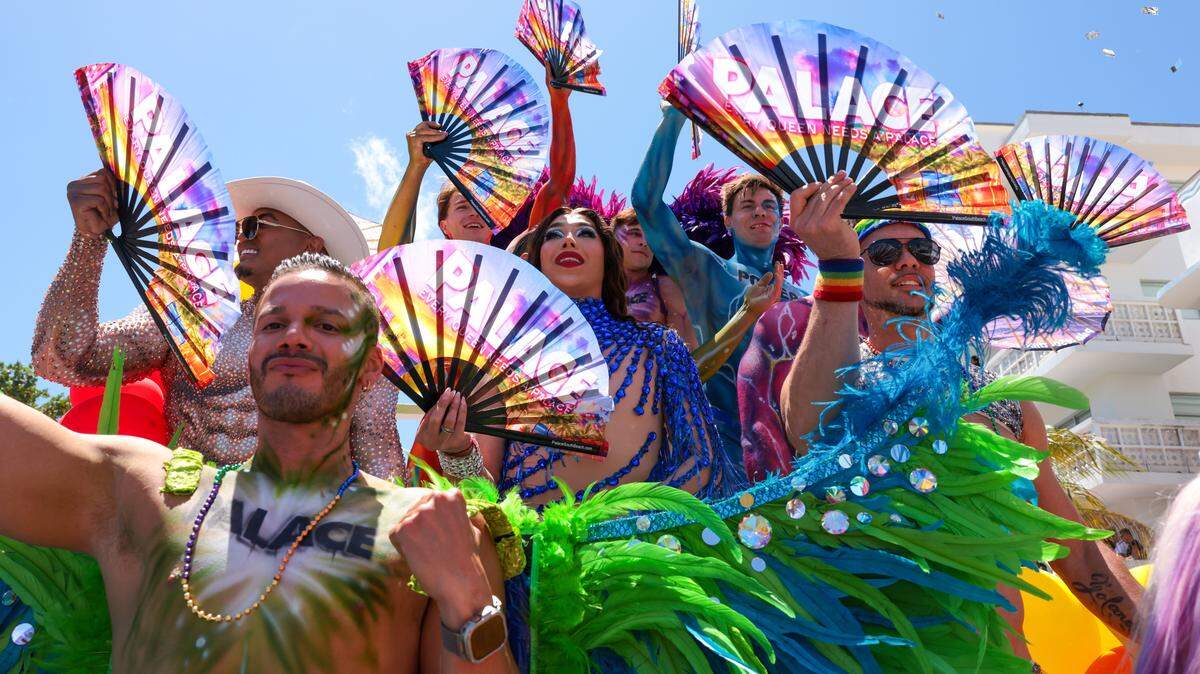 Performers parade on Ocean Drive during the 18th annual pride parade in Miami Beach, Florida, Sunday, April 12, 2026. 