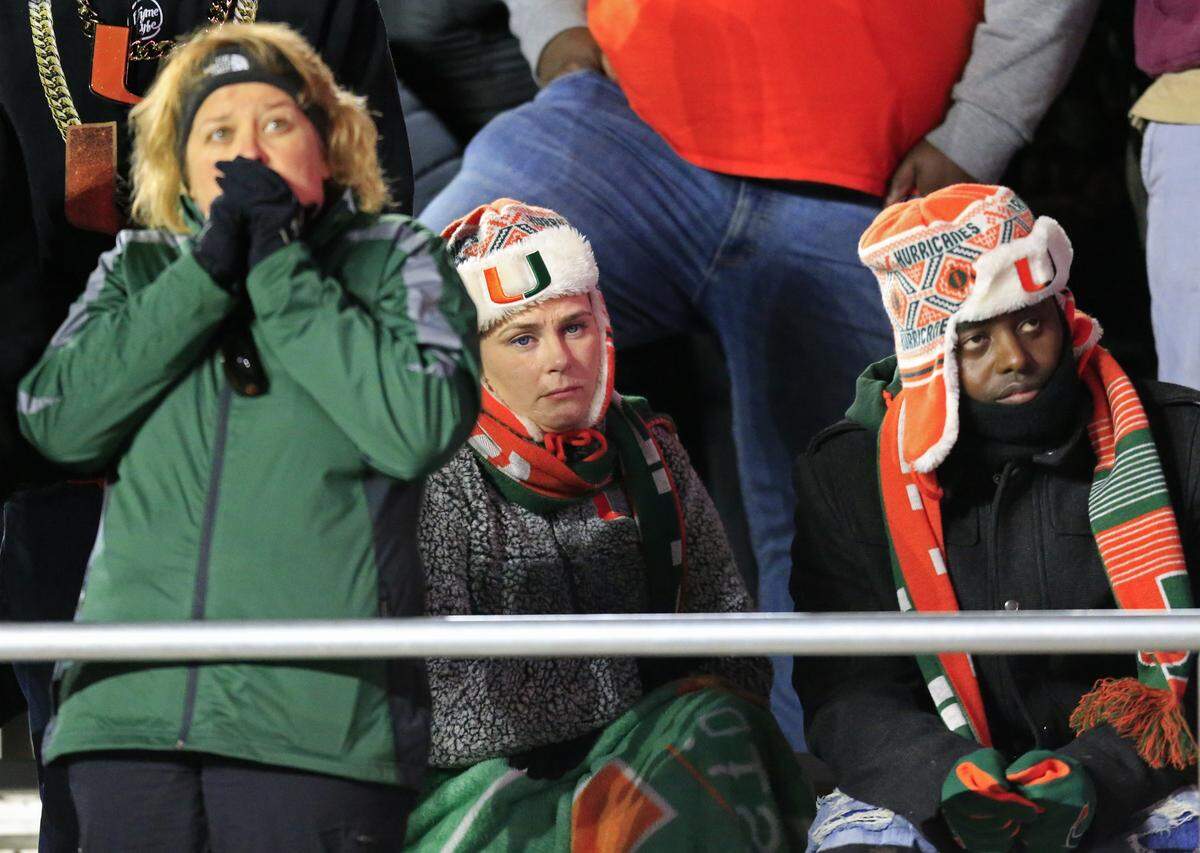 Canes fans watch as Miami trails in the fourth quarter at Boston College’s Alumni Stadium in Chestnut Hill on Friday, October 26, 2018.