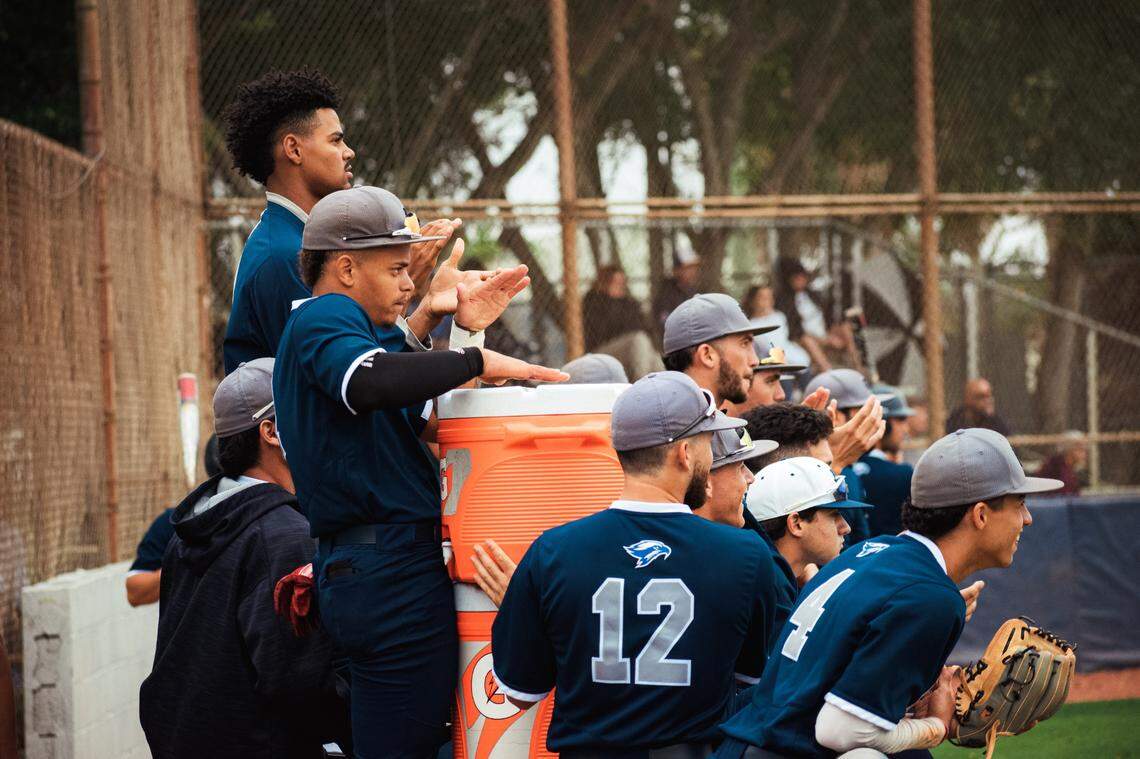 Broward College celebrates on the bench. The Fort Lauderdale junior college program could officially fold June 30, when the school’s Board of Trustees votes on a new budget proposal.