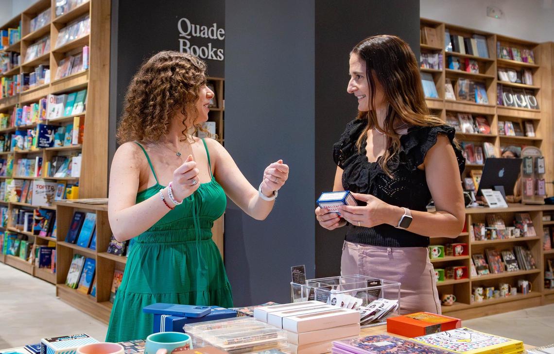 Author of ‘Castle of the Cursed,’ Romina Garber, left, and co-owner of Quade Books in Aventura Mall Evangelina Montiel Bertone talk at the book store on Friday, August 9, 2024 in Aventura, Fla.