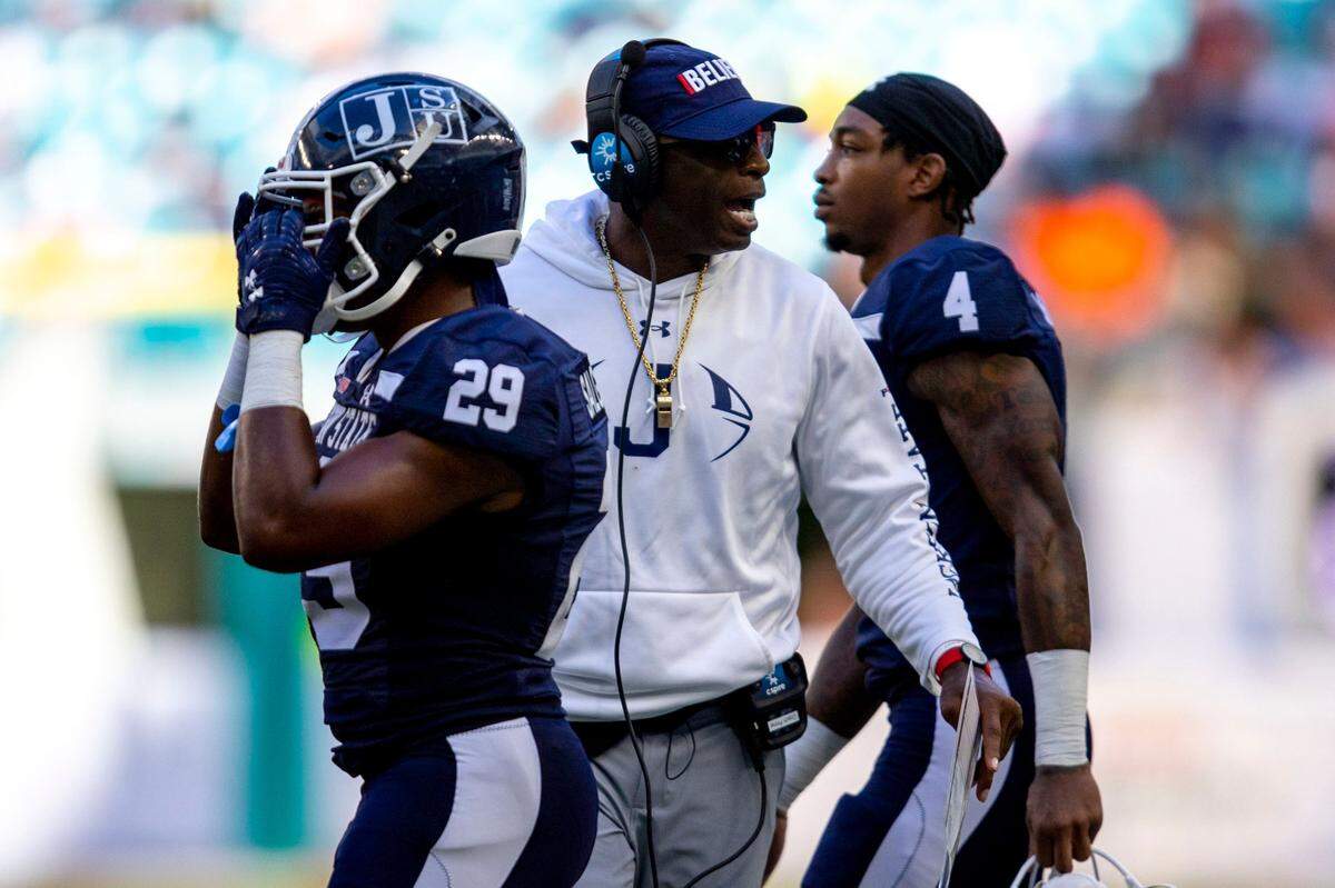 Jackson State University head coach Deion Sanders talks to players during the third quarter of the Orange Blossom Classic against Florida A&M University at Hard Rock Stadium in Miami Gardens, Florida, Sunday, September 4, 2022.