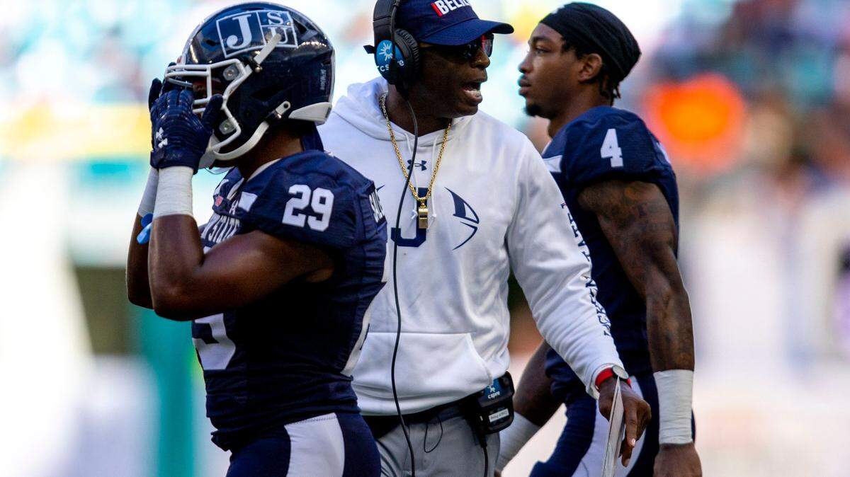Jackson State University head coach Deion Sanders talks to players during the third quarter of the Orange Blossom Classic against Florida A&M University at Hard Rock Stadium in Miami Gardens, Florida, Sunday, September 4, 2022.