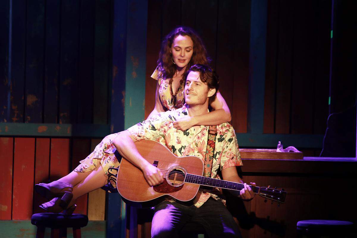 Kayleen Seidl as Rachel and Sam Sherwood as Tully in “Jimmy Buffett’s Escape to Margaritaville” at Actors’ Playhouse at the Miracle Theatre. (Photo courtesy of Alberto Romeu)