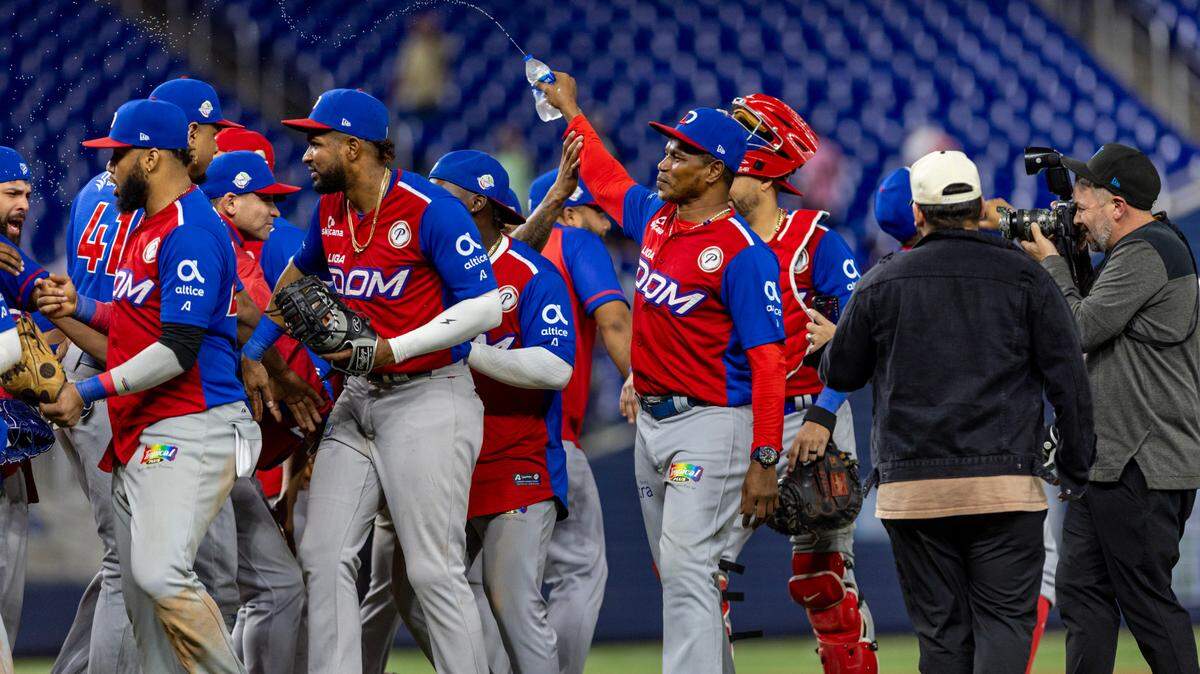 Dominican Republic players and coaches react after the final out of a Caribbean Series Semi baseball game to defat Panama 4-1 at loanDepot park in Miami, Florida, on Thursday, February 8, 2024.