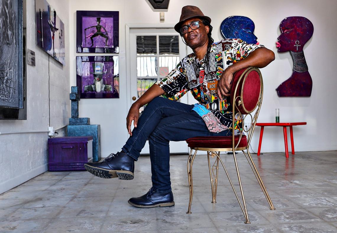Haitian-born artist Jude Papaloko Thegenus sits in his studio, Jakmel Art Gallery, on the edge of Little Haiti near Miami’s Design District in July. Thegenus, who draws inspiration from his Haitian roots, has had to move his studio several times as affordable spaces become scarce.