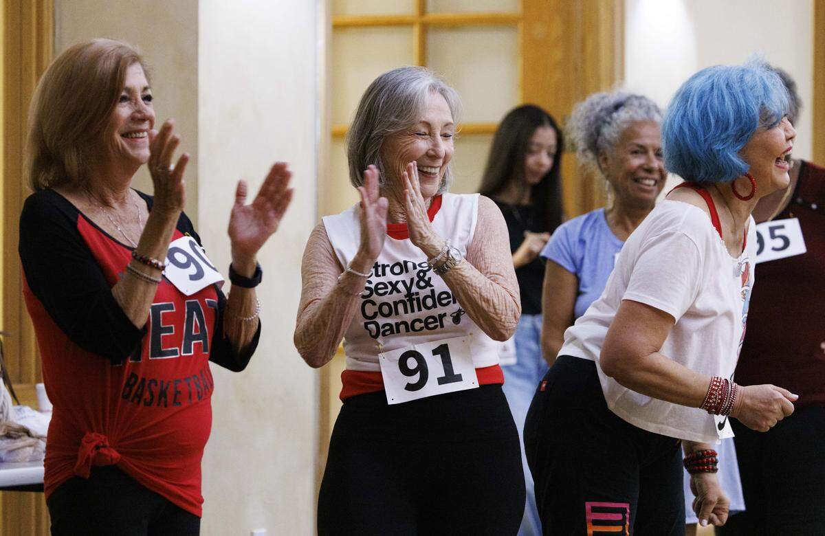Sondra Marcus, left, and Candy Raphan, center, clap for other participants during the Heat Golden Oldies auditions for the Miami Heat senior dance team on Thursday, Sept. 25, 2025, at Southwest Focal Point Community Center in Pembroke Pines, Fla.
