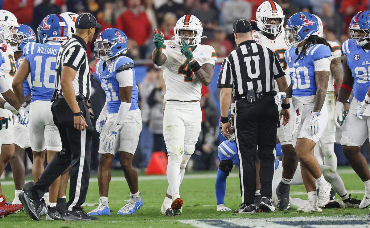 Miami Hurricanes running back Mark Fletcher Jr. (4) signals a first down against the Mississippi Rebels during the first half of a College Football Playoff semifinal in the Fiesta Bowl at State Farm Stadium on Thursday, January 8, 2026 in Glendale, Arizona.