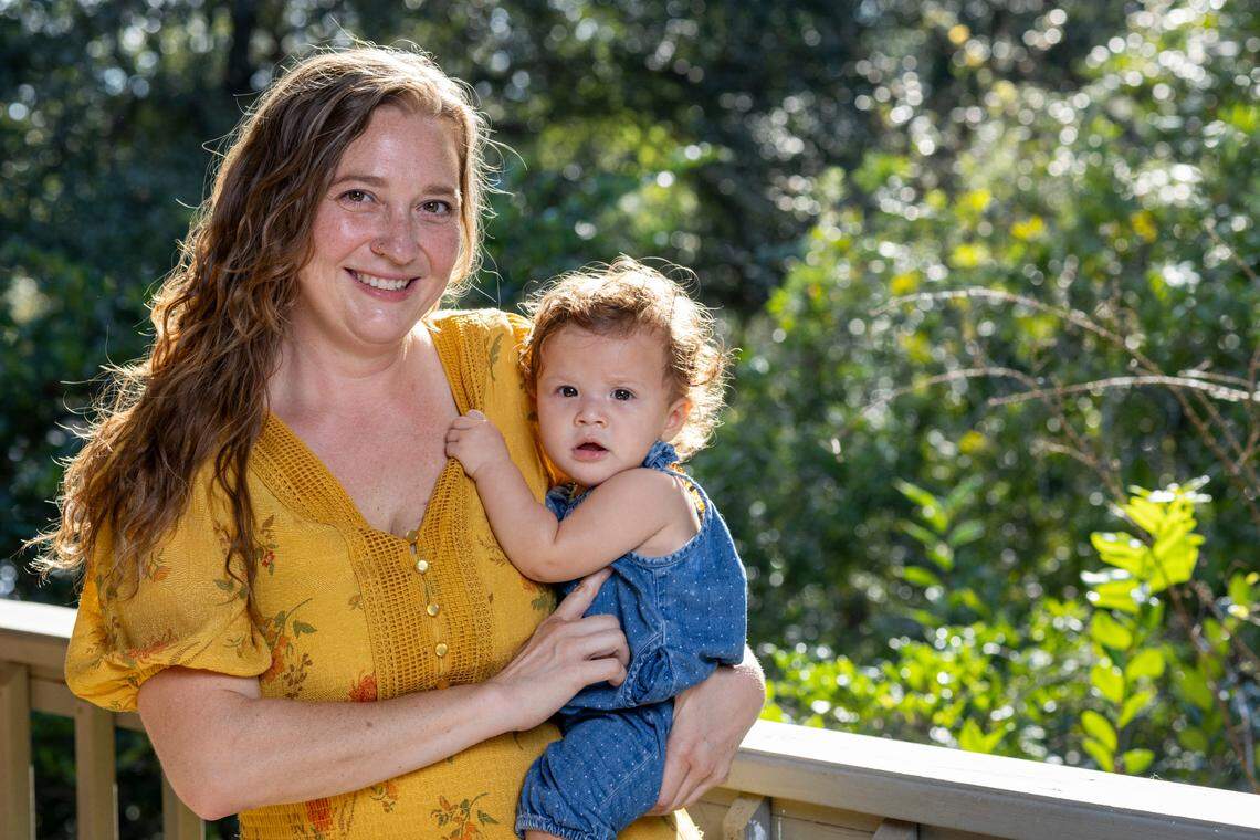 Mandi Rokx of Melrose, Florida, was cut from Medicaid three months after delivering her daughter, Vernita, in February. An unknown number of Florida mothers have been disenrolled from Medicaid despite being eligible for 12 months of continuous coverage. (David Steele for KFF Health News)